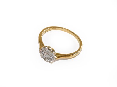 Lot 174 - An 18 carat gold diamond cluster ring, finger...