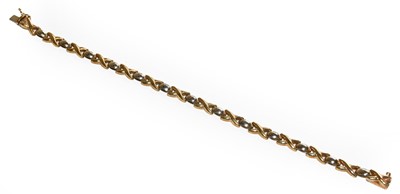 Lot 207 - A 9 carat two colour gold fancy link bracelet,...