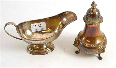 Lot 174 - A silver sauceboat and a silver sugar sifter (2)