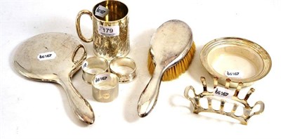 Lot 179 - Silver Christening mug, three silver napkin rings, silver toast rack, silver butter dishes,...