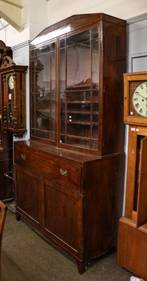 Lot 1390 - A large Regency mahogany secretaire bookcase...