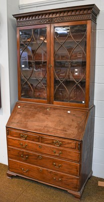 Lot 1401 - A George III mahogany bureau bookcase with a...