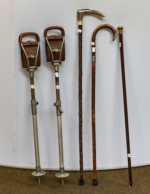 Lot 150 - A walking cane with a 9-carat gold topper,...