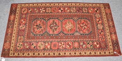 Lot 1119 - Afghan Baluch rug, the field with three Salor...