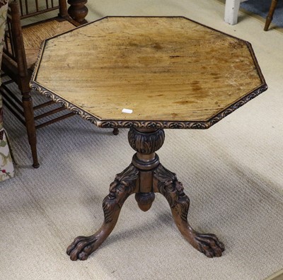 Lot 1405 - A carved mahogany tripod table in 18th century...