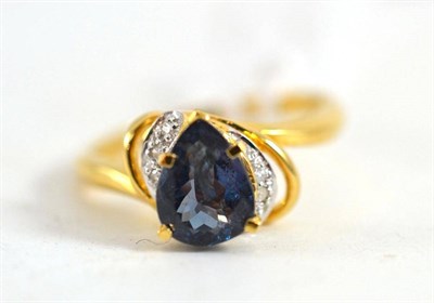 Lot 216 - An 18ct gold alexandrite ring, the pear cut alexandrite in a yellow claw setting, with...