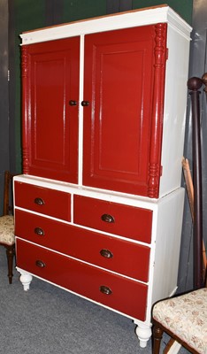 Lot 1205 - A white and red painted pine press cupboard,...