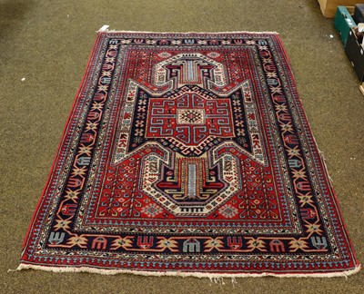 Lot 1105 - Turkish rug of Kazak design, the blood red...