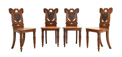 Lot 294 - A Set of Four Regency Oak Hall Chairs, in the...
