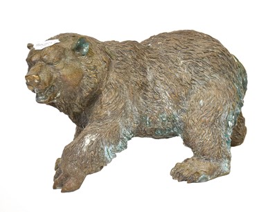 Lot 311 - ~A cast bronze sculpture of a bear, together...