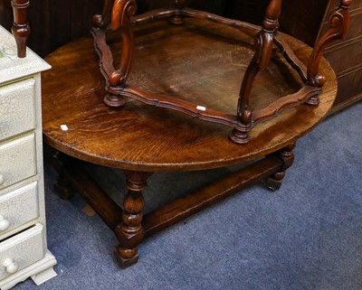 Lot 1221 - A Titchmarsh & Goodwin style oval oak coffee...