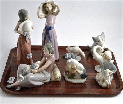 Lot 240 - Six Lladro figures and two Nao groups (8)