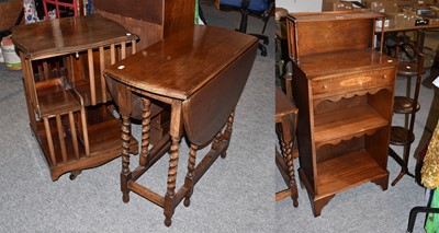 Lot 1396 - An oak gateleg table, a mahogany revolving...