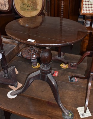 Lot 1402 - A 19th century mahogany tilt-top tripod table...