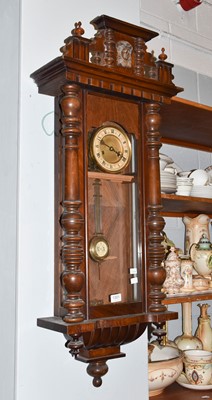 Lot 1301 - A walnut veneered Vienna type striking wall...