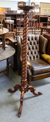 Lot 1252 - A 19th century mahogany torchere, 166cm high