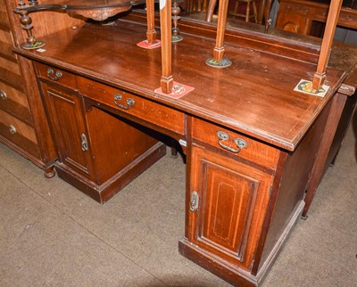 Lot 1421 - ~ An Edwardian inlaid mahogany kneehole desk,...