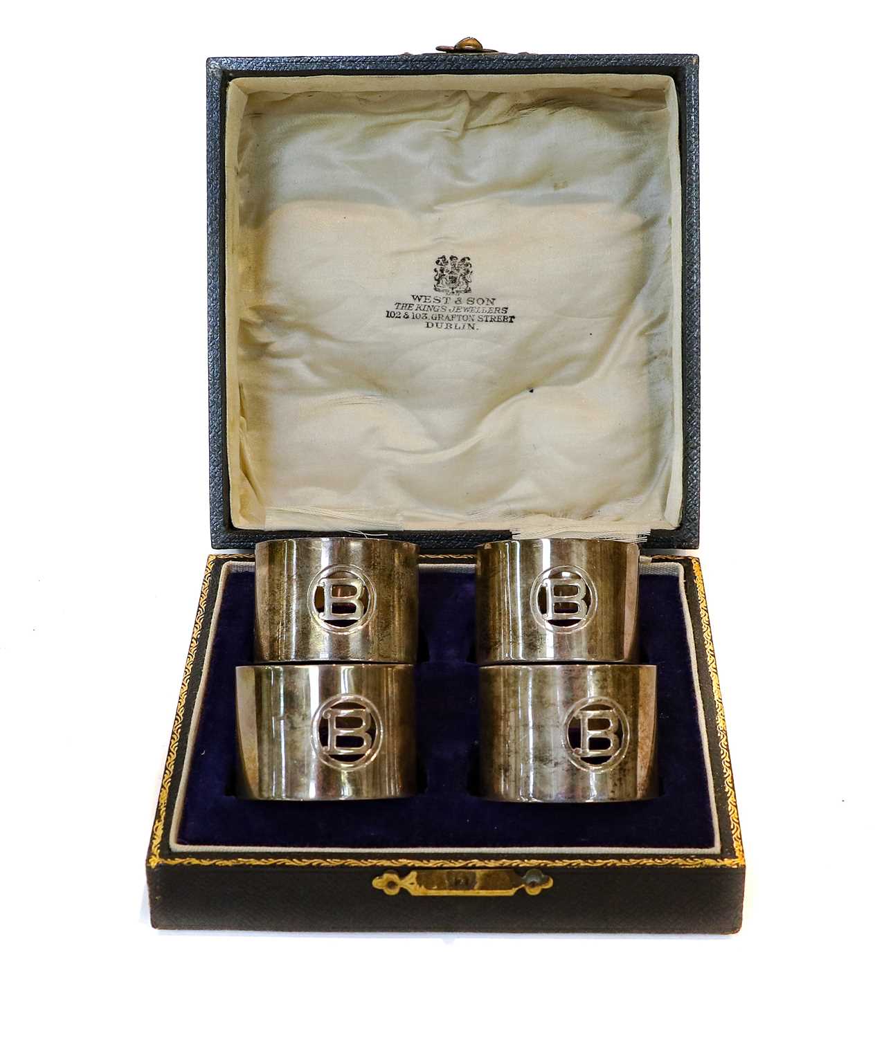 Lot 47 - A cased set of four Irish silver napkin rings,...