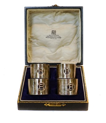 Lot 47 - A cased set of four Irish silver napkin rings,...