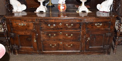 Lot 1450 - An early 18th century 6' oak dresser base, the...