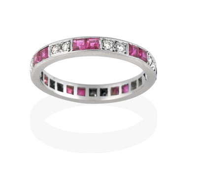 Lot 2434 - An 18 Carat White Gold Ruby and Diamond Eternity Ring