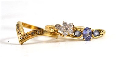 Lot 263 - A 9ct gold diamond cluster ring, a wishbone ring and a tanzanite ring