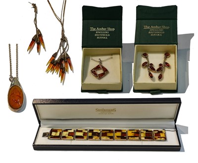 Lot 298 - A collection of amber and amber type silver...