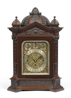 Lot 1055 - A Mahogany Chiming Table Clock, circa 1890, carved floral and scroll panels, pierced side sound...