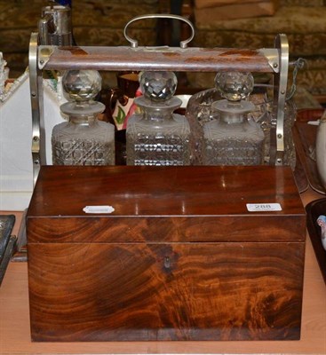 Lot 288 - Oak three bottle tantalus and a mahogany tea caddy with fittings (2)