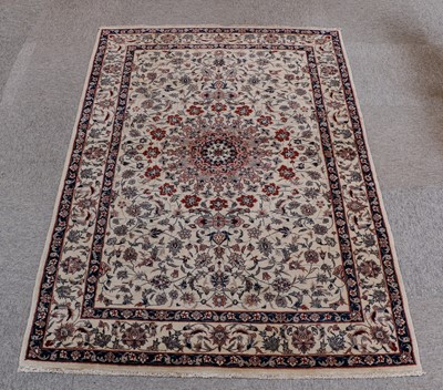 Lot 176 - Indian Rug, modern The ivory field of...