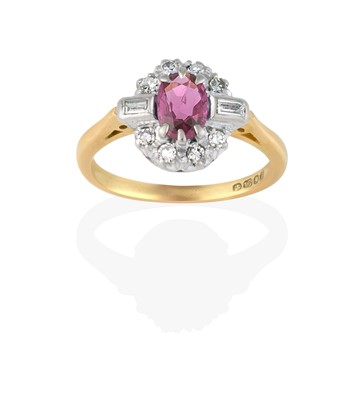 Lot 2438 - An 18 Carat Gold Ruby and Diamond Cluster Ring