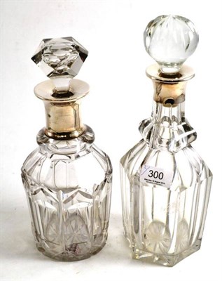 Lot 300 - Two cut glass decanters with silver collars