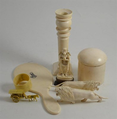 Lot 305 - Early 20th century ivory: candlestick, circular box and cover, hand mirror and a pair of carved...