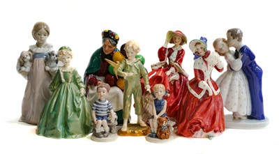 Lot 151 - A collection of porcelain figures including...
