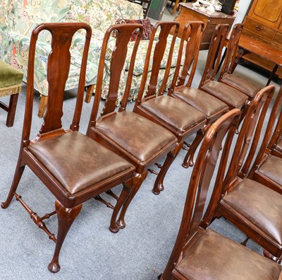 Lot 1199 - A set of twelve Queen Anne style walnut dining...