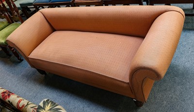 Lot 1207 - A Victorian Chesterfield sofa raised on turned...