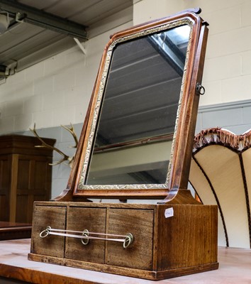 Lot 1237 - A Georgian mahogany three drawer dressing...