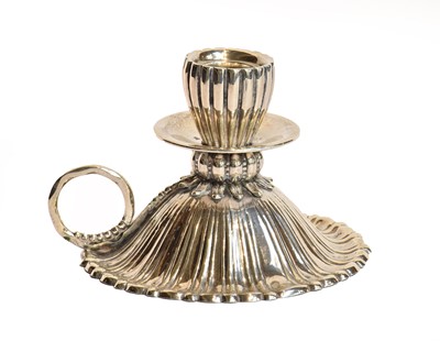 Lot 74 - A Spanish Silver Candlesticks, the base fluted...
