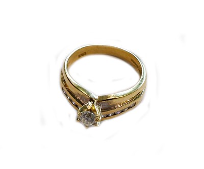 Lot 175 - An 18 carat gold diamond ring, the raised...