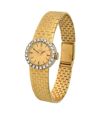 Lot 2234 - Omega: A Lady's 18 Carat Gold Diamond Set Wristwatch