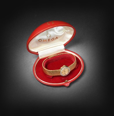 Lot 2234 - Omega: A Lady's 18 Carat Gold Diamond Set Wristwatch