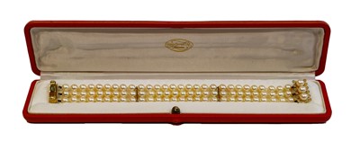 Lot 124 - A 9 carat gold triple row pearl bracelet,...