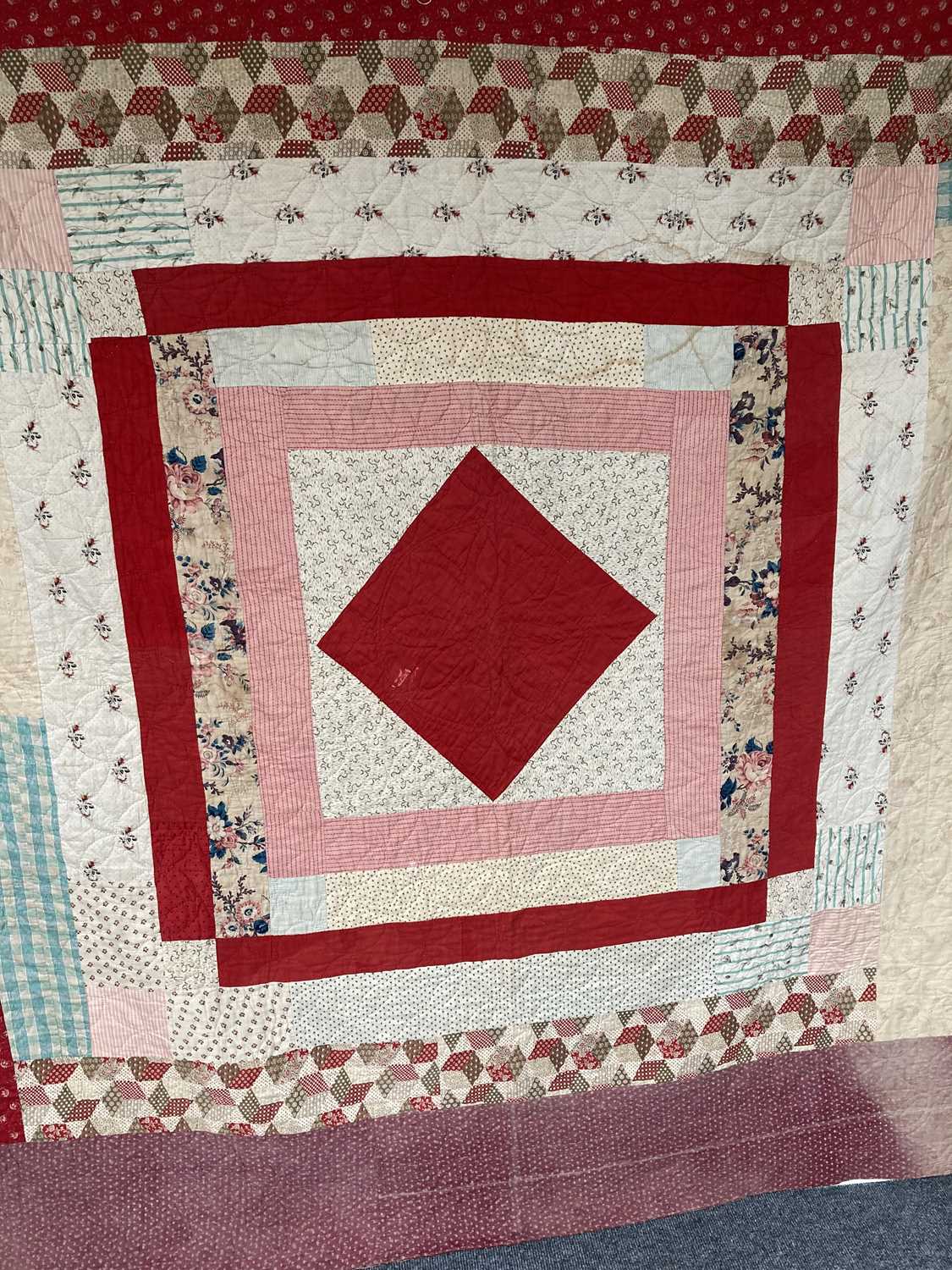 Lot 2179 - A Mid 19th Century Patchwork Quilt, with...