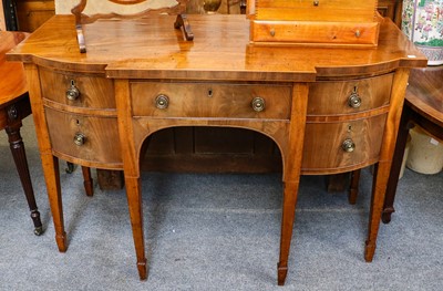Lot 1196 - A George III mahogany breakfront sideboard of...