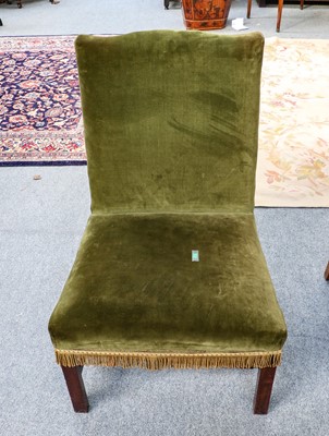 Lot 1198 - A mahogany framed wing back chair with loose...