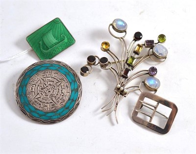 Lot 369 - A green enamelled Norwegian brooch, a gem set spray brooch, a buckle brooch and another brooch (4)