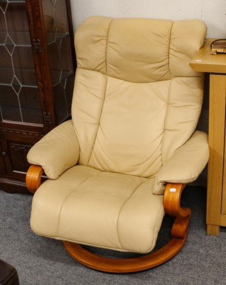 Lot 1116 - A Himolla leather swivel easy chair