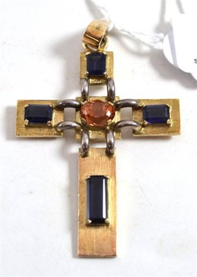 Lot 375 - A gemstone cross, the textured mount set with an oval cut topaz centrally and a baguette cut iolite