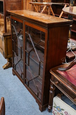 Lot 1228 - An Edwardian mahogany astragal glazed bookcase,...