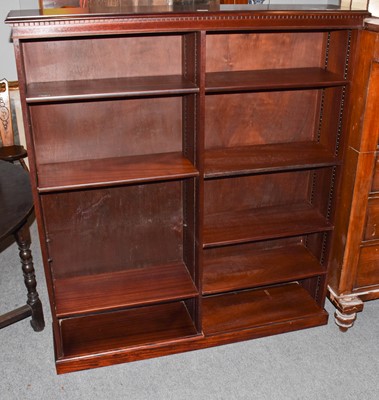 Lot 1235 - A modern mahogany open bookcase with...